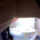 A hidden camera placed under a sink records a woman bending over in front of a public toilet to take a piss and a shit. Poop is clearly seen falling out of her ass with an audible plop. Over a minute.
